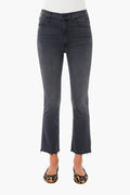 A person is shown from the waist down wearing MOTHER high-waisted, dark gray straight-leg jeans with raw hems and leopard-print flats.