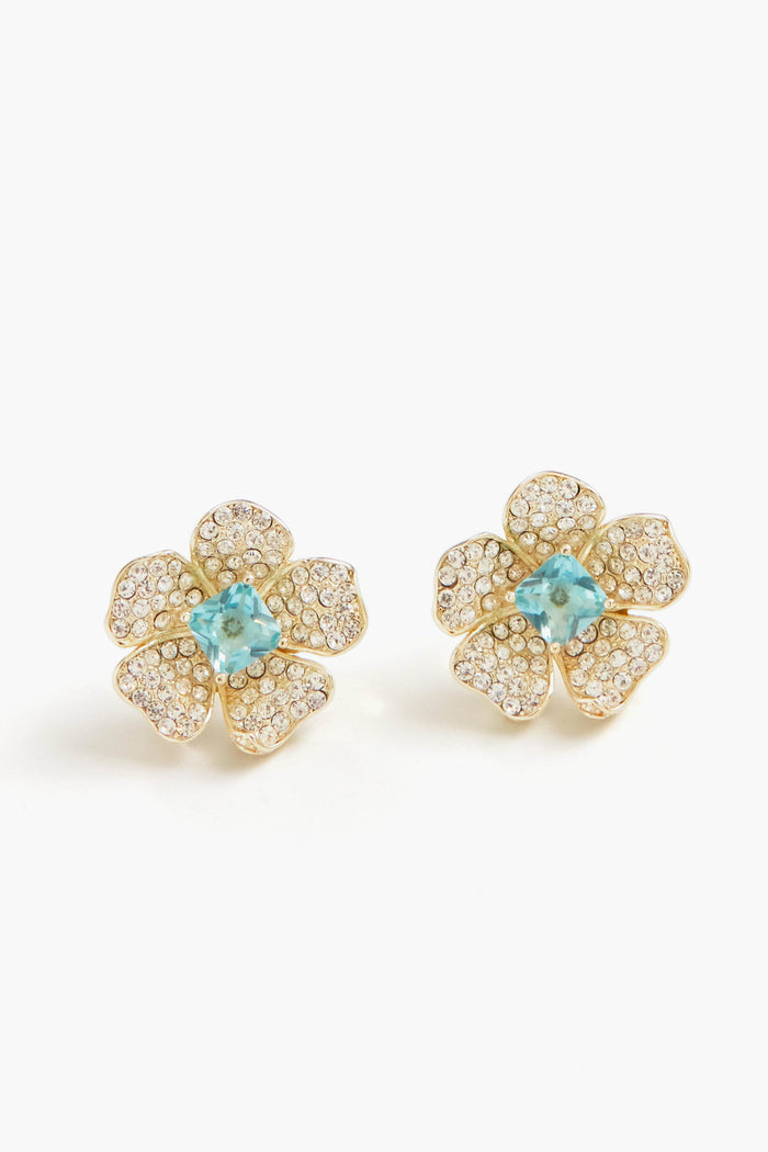 Nicola Bathie gold flower studs feature petals encrusted with small clear stones and a London Blue gemstone at the center, crafted in a 14k gold-plated finish.