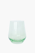 The Estelle Colored Glass tumbler features a wide base, narrow opening, and clear glass with a hint of green—ideal for anyone who appreciates luxury glassware.
