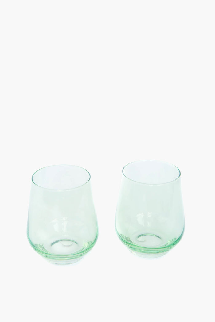 Mint Stemless Wine Glasses Set of 6, featuring classic, slightly green-tinted hand-blown glass. Their effortless, high-end design adds a fun, chic touch to any table.