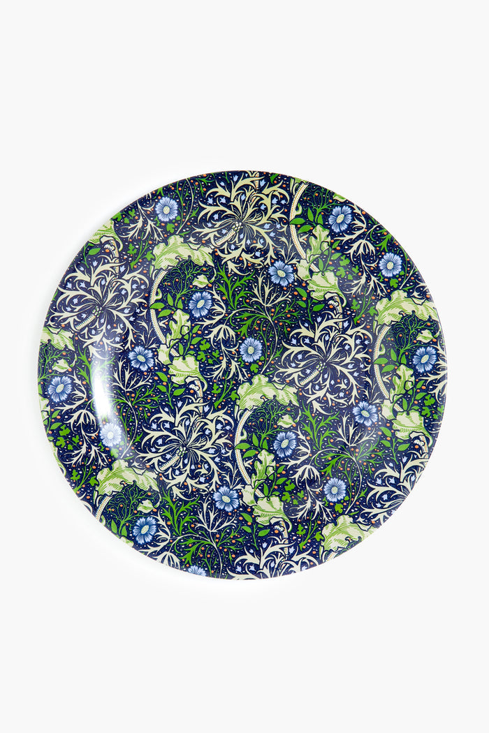 Round plate with a detailed floral pattern in blue, green, and white by One Hundred 80 Degrees—a lovely botanical-inspired addition to your Tuckernuck table setting.
