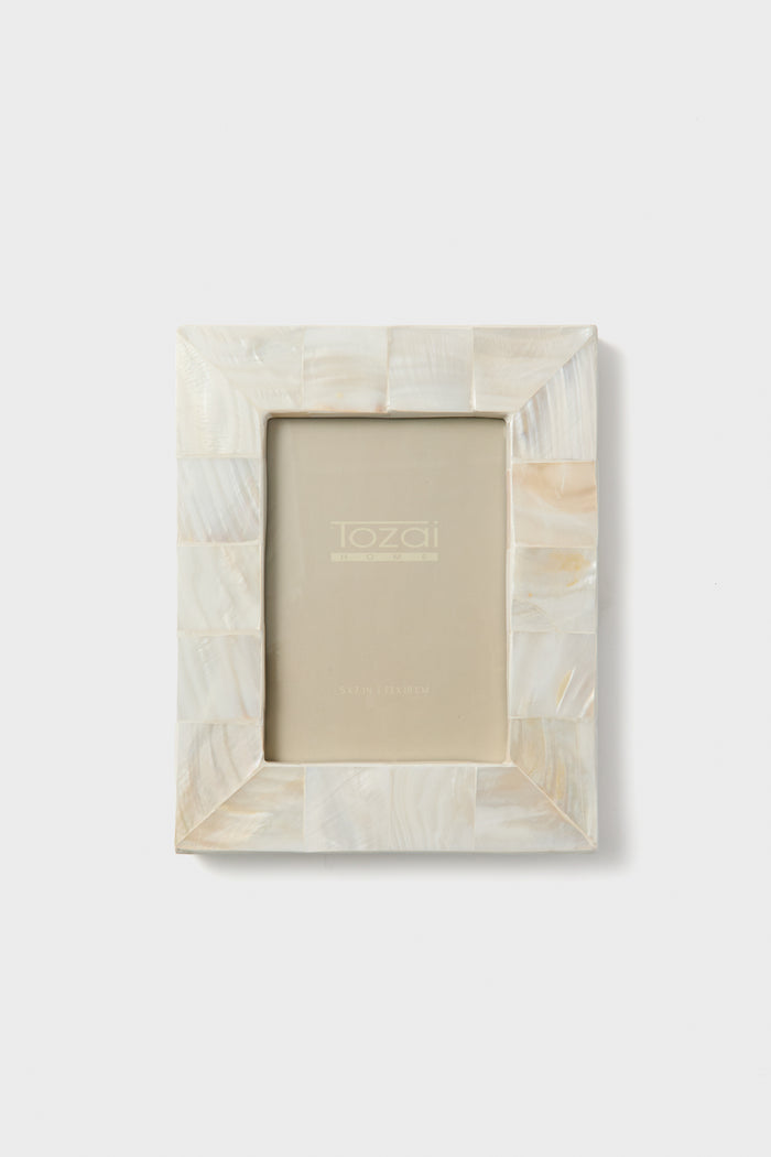 Two's Company rectangular picture frame with a mosaic pattern in white and cream mother of pearl, displayed upright—an elegant collectible or thoughtful housewarming gift.