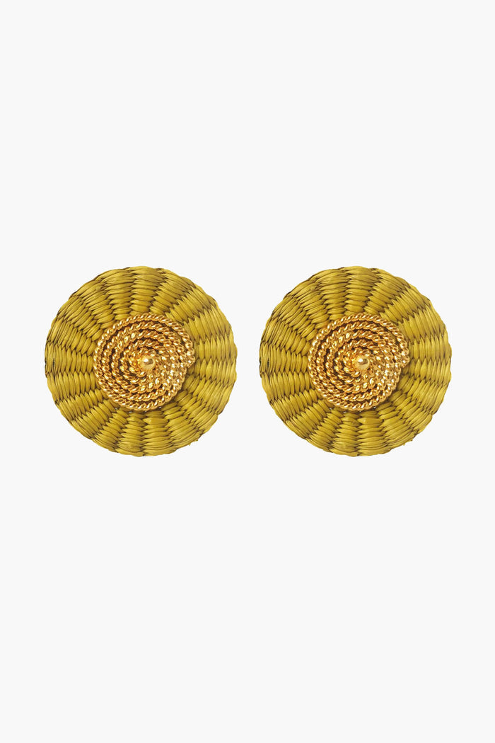Ana Carolina Valencia's gold-plated iraca palm earrings feature a concentric circular design, perfect for fans of handmade jewelry.