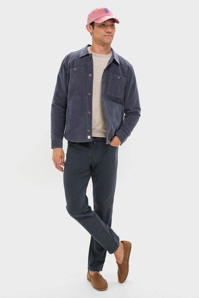 Man wearing the classic Nantucket Red Dancing Bear Needlepoint Hat, combining effortless style with fun, high-end needlepoint detailing and adjustable fit for any casual occasion.