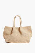 The Mar y Sol large woven raffia tote bag features two handles and sustainable materials, making it the perfect slouchy beach bag.