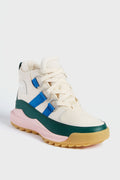 The Sorel Ona Chukka is a high-top sneaker with a cream upper, green and pink accents, blue side stripes, and a tan sole—perfect for those seeking stylish insulated winter footwear.