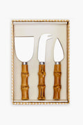 The Two's Company cheese knife set features stainless steel blades and bamboo-style handles in a sleek rectangular box—ideal charcuterie accessories for any gathering.
