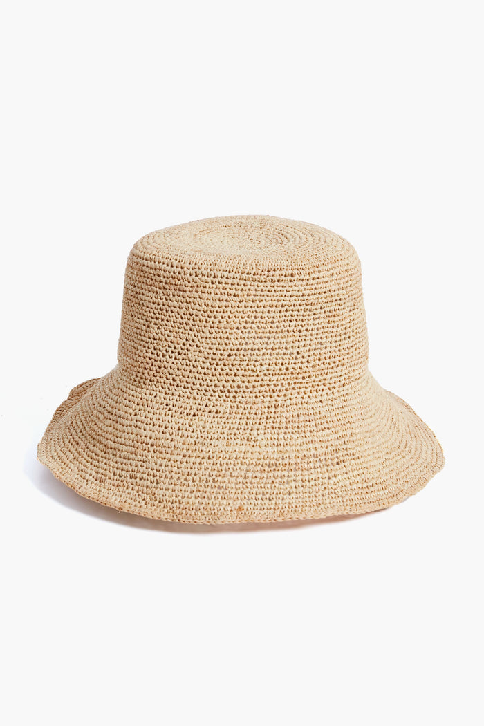The Hat Attack bucket hat features beige raffia in a woven crochet style, a wide brim, and an adjustable sweatband.