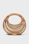 The Aranaz semi-circular handmade rattan bag features layered curved handles and a light fabric lining—an ideal choice for fans of artisanal accessories.