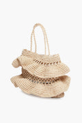 The Hat Attack beige woven raffia bag features layered ruffled detailing and two braided handles—a chic accessory for any look.