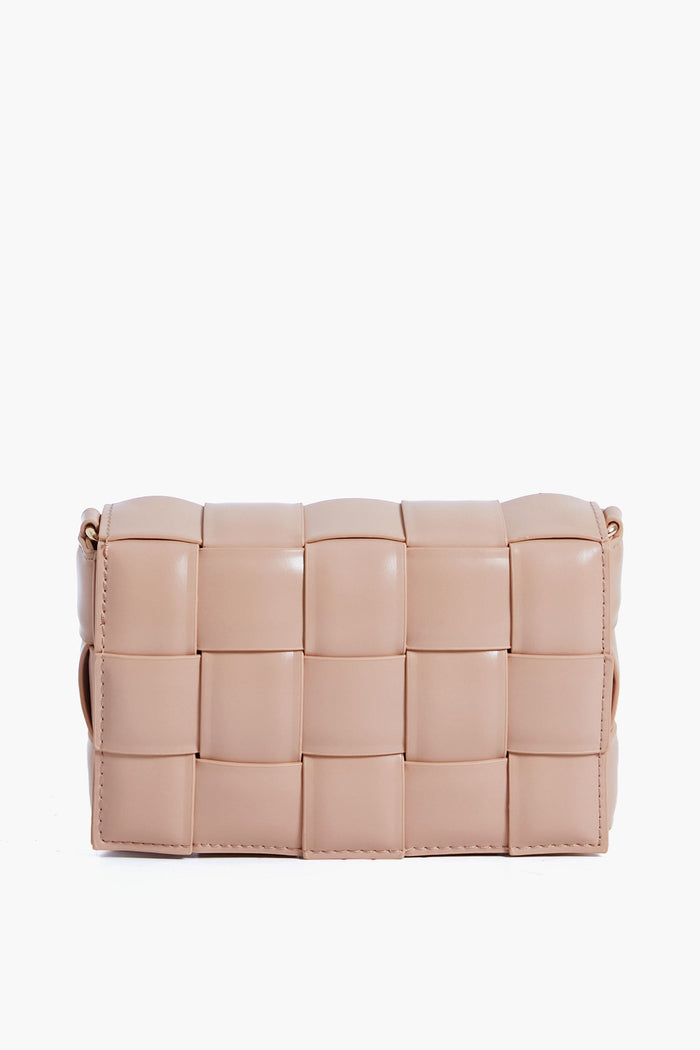 Urban Expressions offers a stylish, animal-friendly rectangular crossbody bag in light beige with a woven, padded leather design.