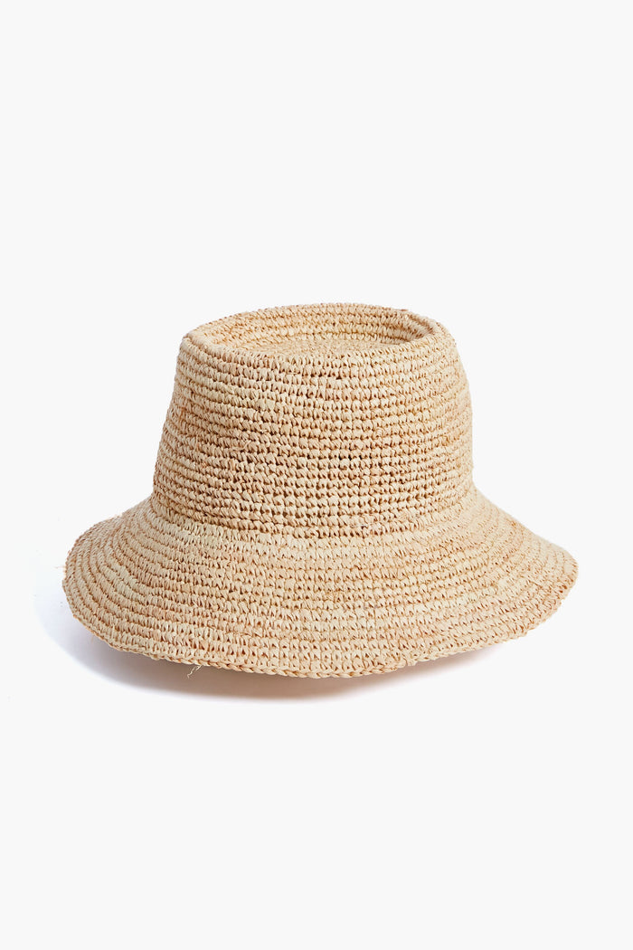 A classic woven bucket hat by Wyeth, featuring beige raffia straw and a wide brim.