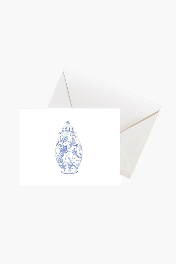 A Sara Fitz white card with a blue and white ginger jar illustration sits before a plain white envelope—perfect for classic elegance stationery or chinoiserie-inspired notes.