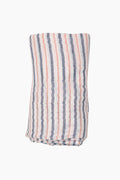 Angel Dear organic cotton swaddle in white with vertical blue and red stripes, ideal as a baby blanket.