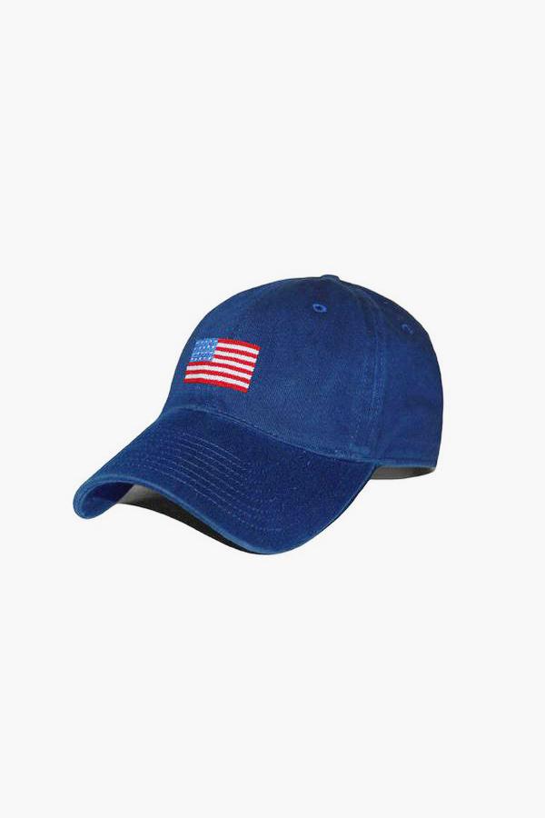 A blue cotton twill flag baseball cap from Smathers and Branson, featuring a small embroidered American flag on the front left side.