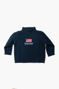 A Soft Idea navy blue long-sleeve cotton turtleneck sweater with "thatcher" and an embroidered American flag on the front. Made in USA. Machine washable.