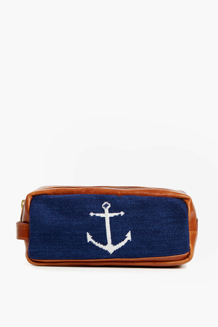 Smathers and Branson rectangular needlepoint toiletry bag with brown Italian leather trim and a blue fabric front featuring a white anchor design.