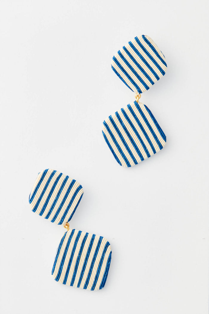 Tuckernuck Jewelry geometric drop earrings with two square, fabric-covered segments in navy and white vertical stripes, connected by gold links.