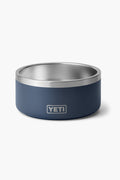 A YETI Dog Bowl in blue and silver with a matte finish, crafted from durable stainless steel and dishwasher safe, rests on a clean white surface.