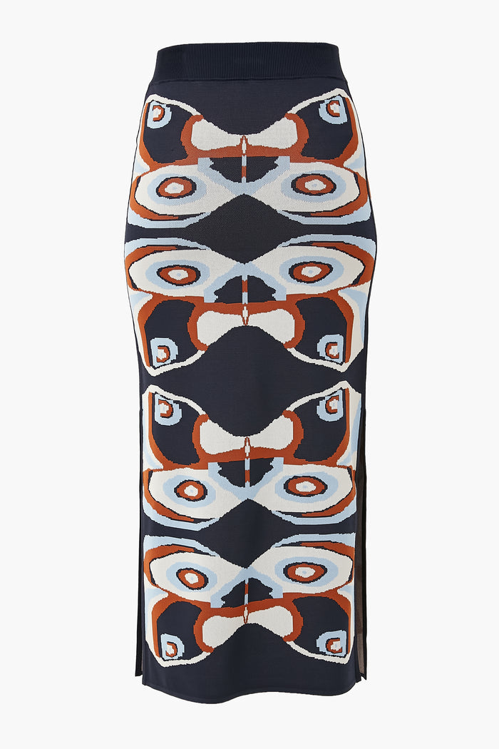 ALEXIS Navy Nylah Skirt: Midi knit skirt with a geometric abstract pattern in navy, rust, white, and light blue, featuring side slits for a modern womenswear look.