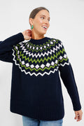 A woman wearing a cozy Barbour Fair Isle sweater.