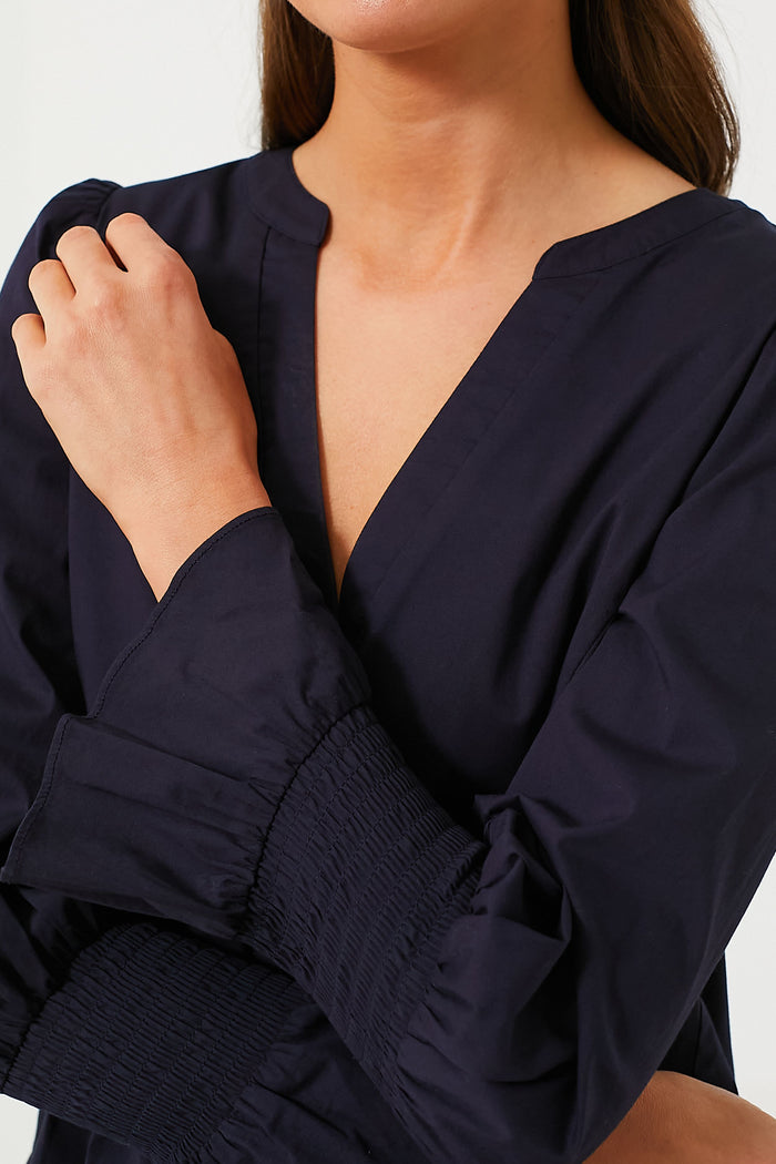 Navy Cotton Poplin Kenzo Dress with classic V-neck, long sleeves, and smocked cuffs, exuding effortless style and fun for high-end casual or date night looks.