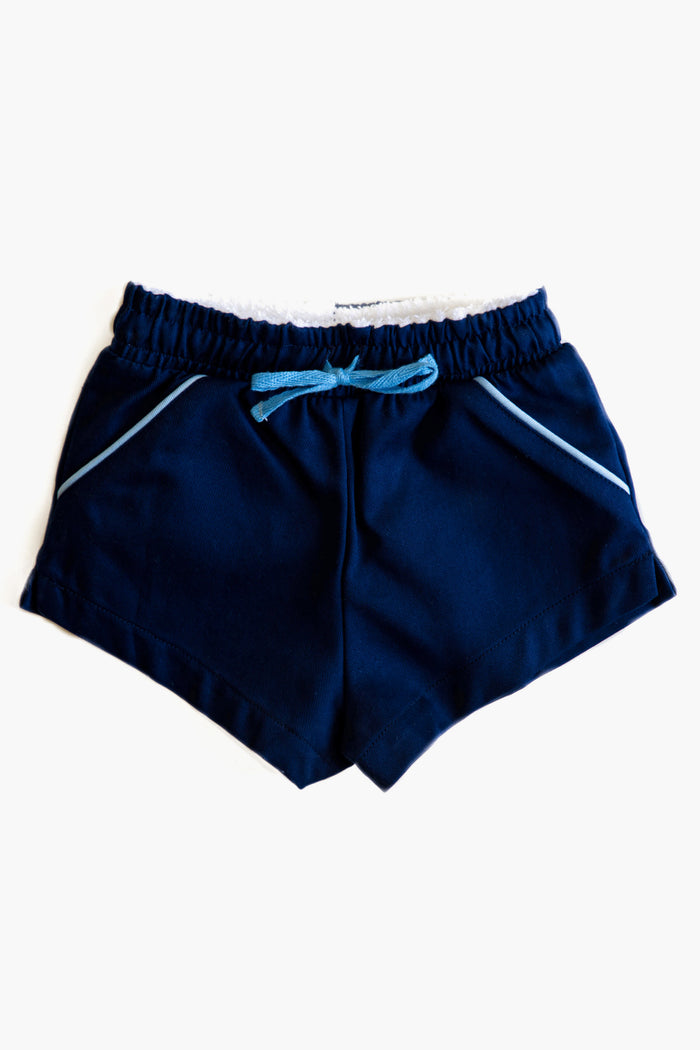 Cadets navy blue boys' shorts with an elastic waistband, blue drawstring, and light blue piping on the pockets. Perfect cotton shorts for active kids.