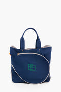 A navy blue CB Station tennis tote bag with two handles and a large, round zippered front pocket, featuring green embroidered initials FB.