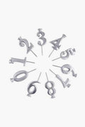 Mariposa silver number-shaped candles (0–9) arranged in a circle on recycled aluminum holders—an ideal handcrafted gift.