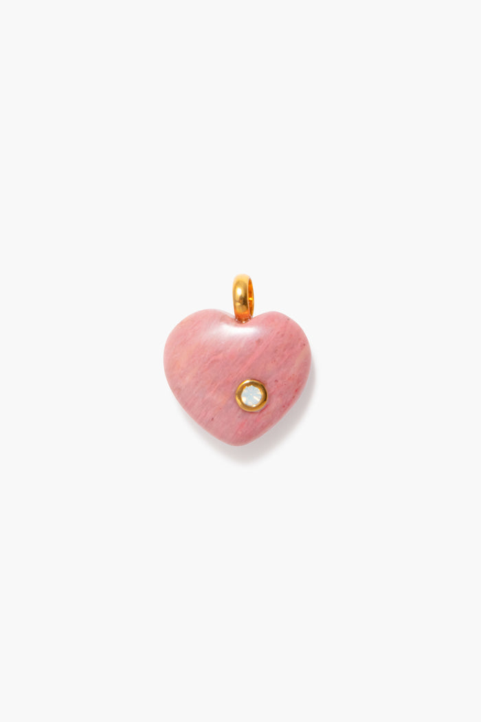 Tuckernuck Jewelry’s pink heart-shaped pendant features a small round gemstone and gold loop, making it the perfect Opal Birthstone Charm or October birthday gift for a charm necklace.