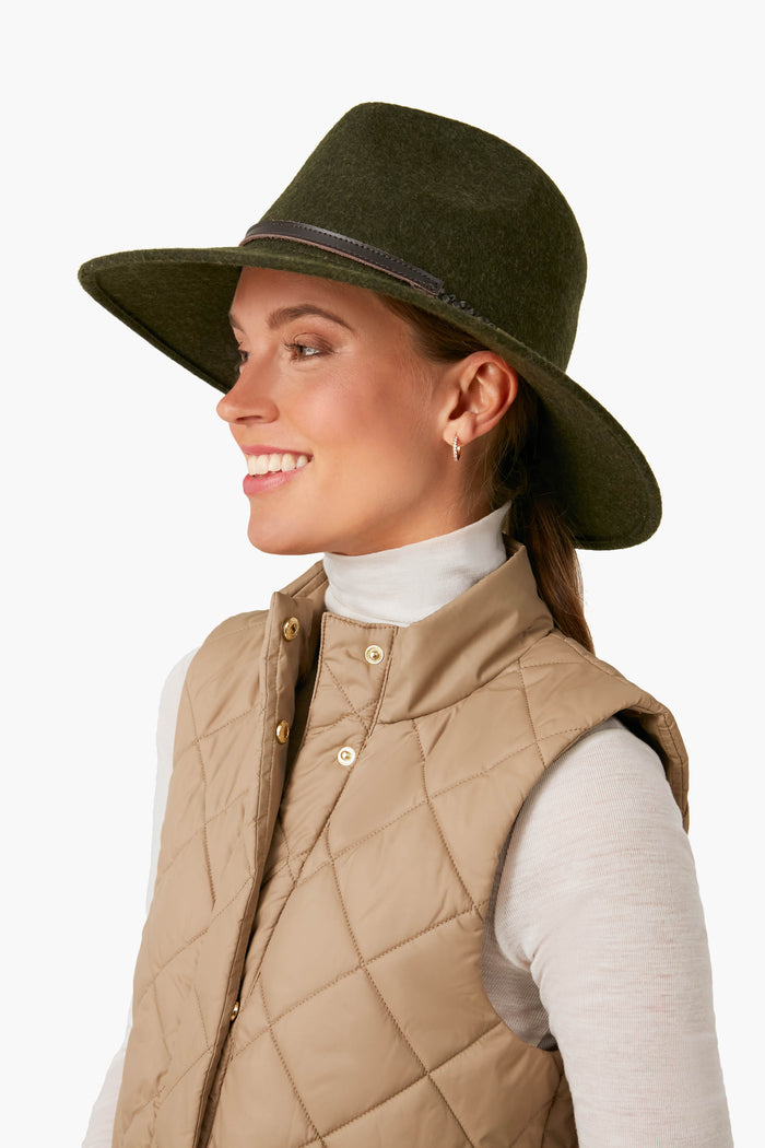 Young woman models the classic Olive Melange Tack Fedora with wide brim, showcasing its effortless high-end style and fun leather band detail.