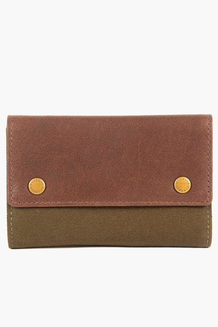 A brown and olive green Barbour wallet with a textured finish and two gold snap buttons on the front flap—ideal for carrying your manicure set or travel grooming kit.