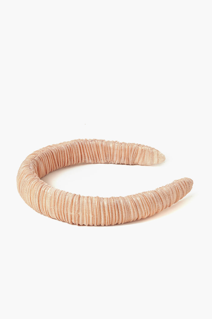 Loeffler Randall’s thick pleated headband, covered in ruched light pink fabric, adds chic elegance to any outfit.