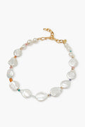 A delicate Lizzie Fortunato bracelet featuring irregularly shaped white pearls, small colored beads, and a gold chain with a lobster clasp.