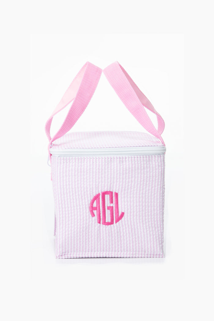 A Caton's Wharf pink and white striped snack bag with pink handles, featuring the initials AGL monogrammed on the front.