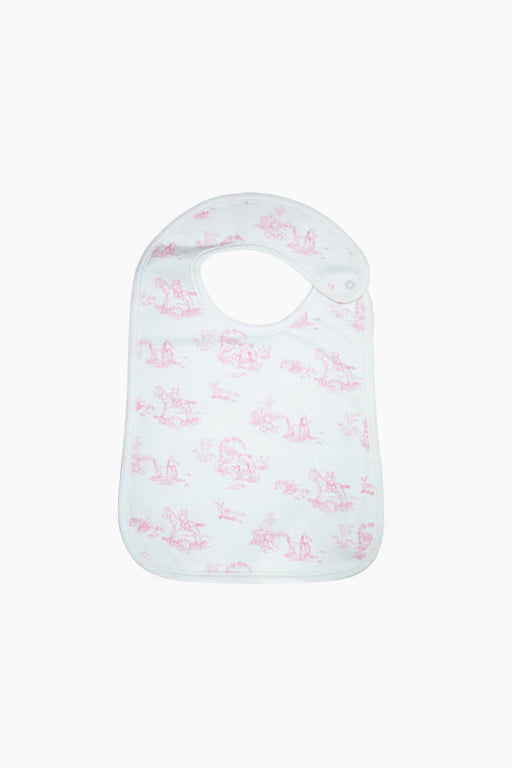 Nella Pima white baby bib in soft Peruvian Pima cotton with a light pink toile pattern and snap neck closure—ideal as a baby gift or for feeding.
