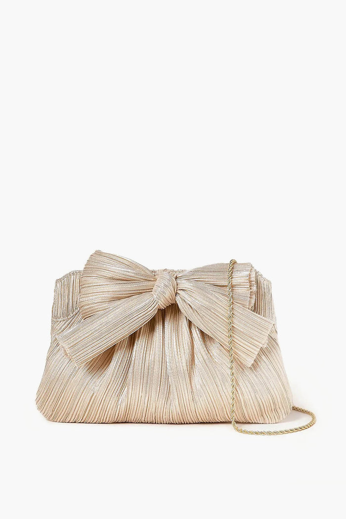 The Loeffler Randall Platinum Rayne Pleated Frame Clutch features a gold pleated design, large lamé bow on the front, and a thin gold chain strap—an elegant designer evening bag for any special occasion.