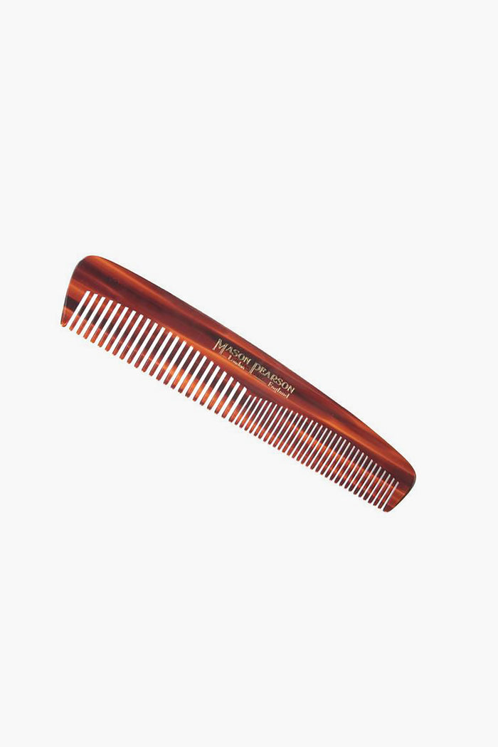 A brown Mason Pearson pocket comb with fine and wide teeth is shown, perfect for convenient on-the-go grooming.