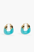 Lizzie Fortunato gold-plated hoop earrings with turquoise accents and a hinged clasp, displayed in a minimalist setting.