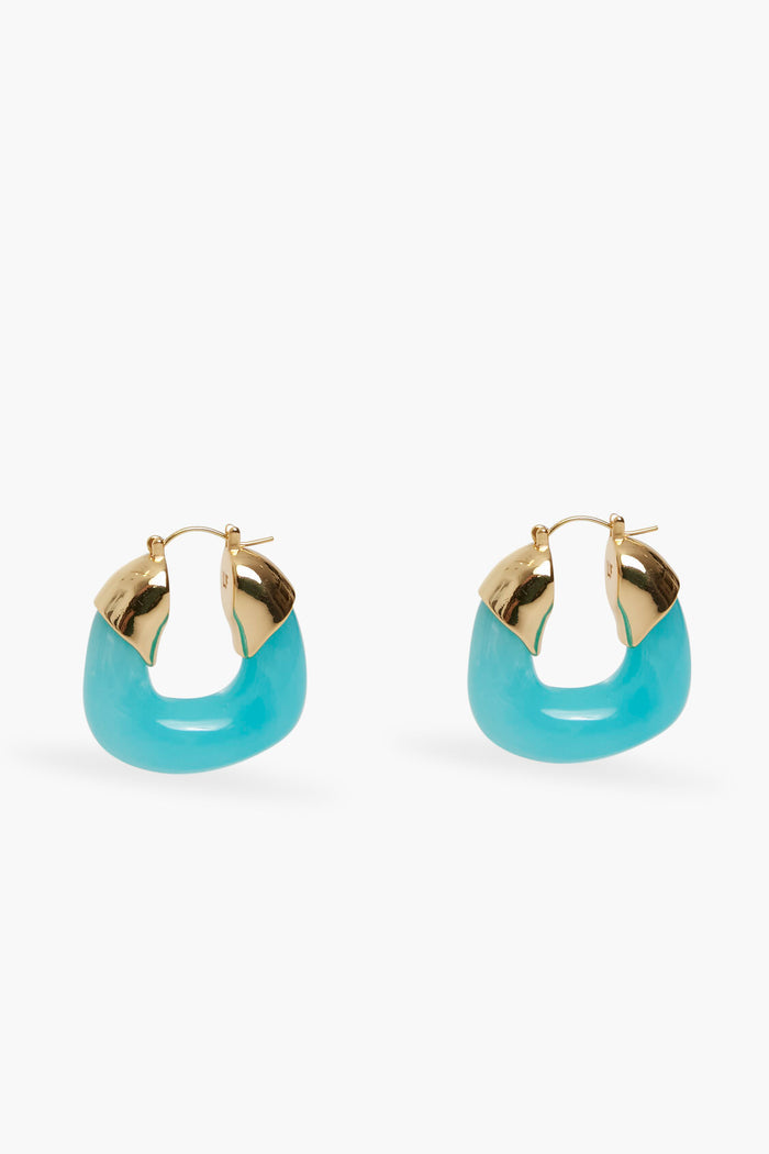 Lizzie Fortunato gold-plated hoop earrings with turquoise accents and a hinged clasp, displayed in a minimalist setting.