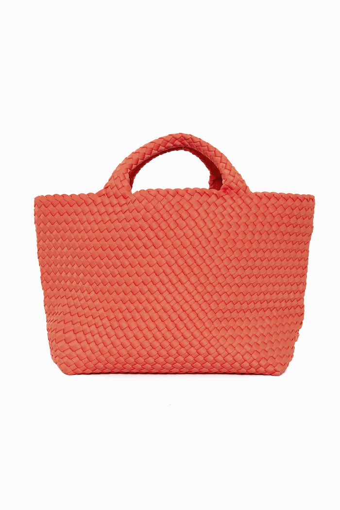 A stylish Naghedi medium tote in coral with woven design and two short handles, perfect for carrying your essentials.