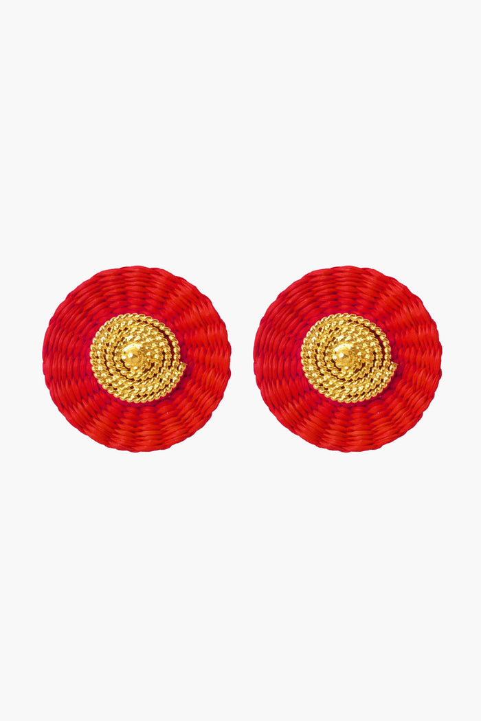 Ana Carolina Valencia's round handmade earrings feature a red woven outer circle and a textured gold-plated center—ideal for lovers of contemporary jewelry.