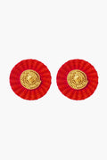 Ana Carolina Valencia's round handmade earrings feature a red woven outer circle and a textured gold-plated center—ideal for lovers of contemporary jewelry.