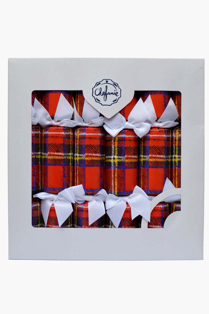 A box of six Chefanie Plaid Poppers Christmas crackers features red tartan patterns and white bows, packaged in white with a clear window and label—perfect as festive party favors for your holiday table.