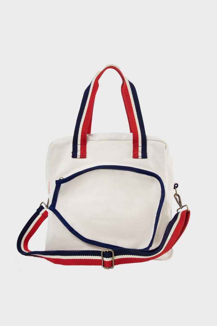 The CB Station white canvas tote features red and navy handles plus a detachable striped shoulder strap—ideal as a stylish pickleball bag or a perfect pickleball gift.