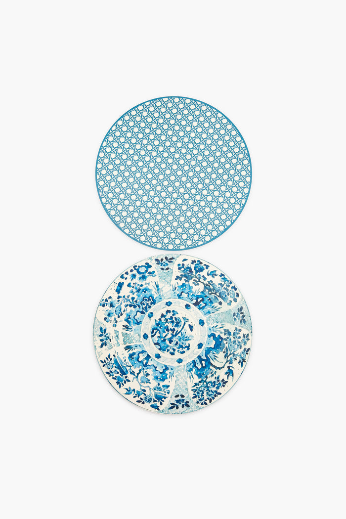 Two round plates from Holly Stuart Home with blue and white designs—the top has a geometric pattern, the bottom a floral motif—ideal as inspiration for handcrafted placemats or as a thoughtful hostess gift.