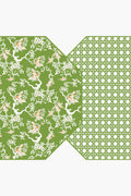 A green geometric pattern on the right overlaps with a green floral bird and branch motif on the left—Holly Stuart Home's reversible placemats, ideal for enhancing your handcrafted tableware and dining room decor.