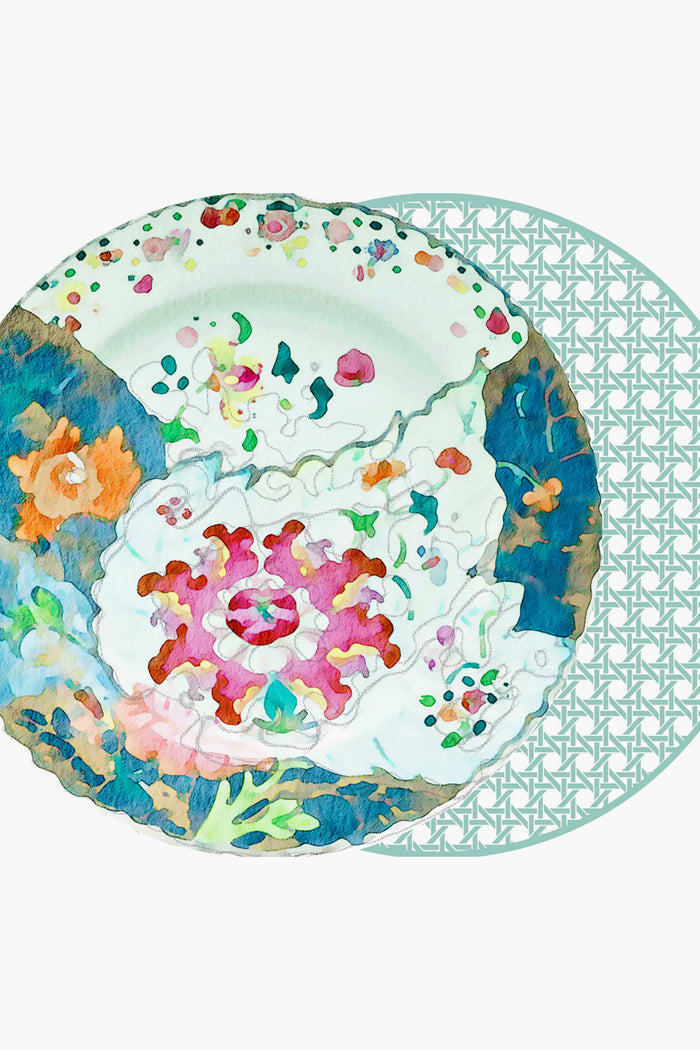 A watercolor floral plate illustration partially overlaps a round mat with a lattice pattern—an ideal reversible placemat or unique tableware accent from Holly Stuart Home to elevate your home decor.