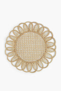 Expertly crafted by Coro Cora, this round woven Iraca palm placemat features a floral-inspired scalloped edge and an open lattice center, showcasing the artistry of Colombian accessories.