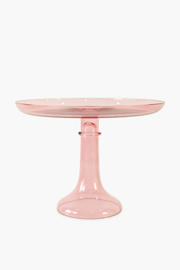 The Estelle Colored Glass pink cake stand features a wide, flat top and sturdy flared base, highlighting the elegance of luxury hand-blown colored glassware.
